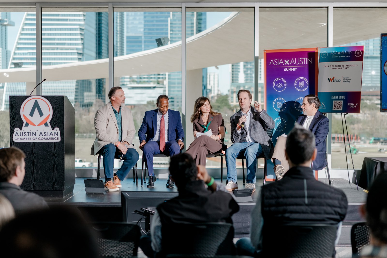 A panel discussion in a sunlit room at Asia X Austin.