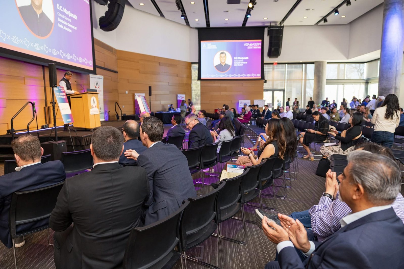 A speaker and attendees at the Asia X Austin summit.